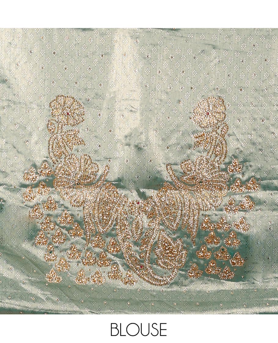 Purple Vastrakala Silk Saree, Spotlighted with Jacquard and Embroidery Work, Complemented by Contrast Traditional Zari and Cut Embroidered Scallop Border, Gleaming Mughal-Style Zari Weave Stone Work Pallu, and Paired with Contrast Heavy Embroidered Blouse