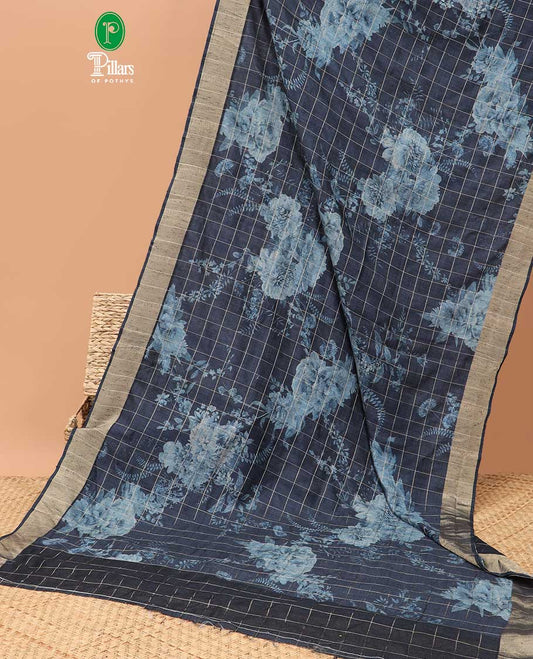 Navy blue checks with floral printe semi tussar saree, gold zari bawanchi border & printed pallu along with checked blouse