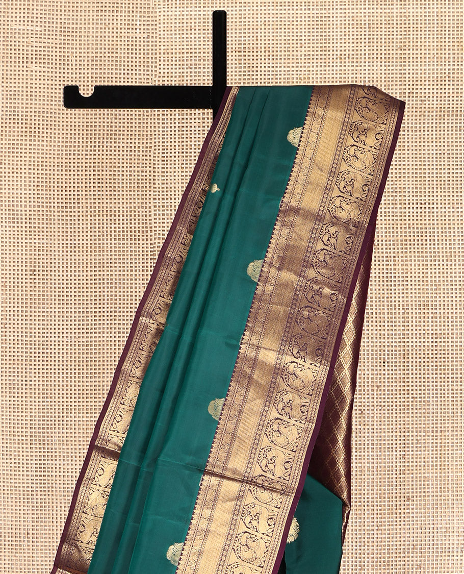 Green Vasundhara Lite Silk Mix Saree, Adorned with Zari Buttas, Contrast Border of Thilakam, Yaanai, Mayil Kann, Muthu, Kamalam, Annam, and Yaali, Jaal Pallu, and a Contrast Blouse
