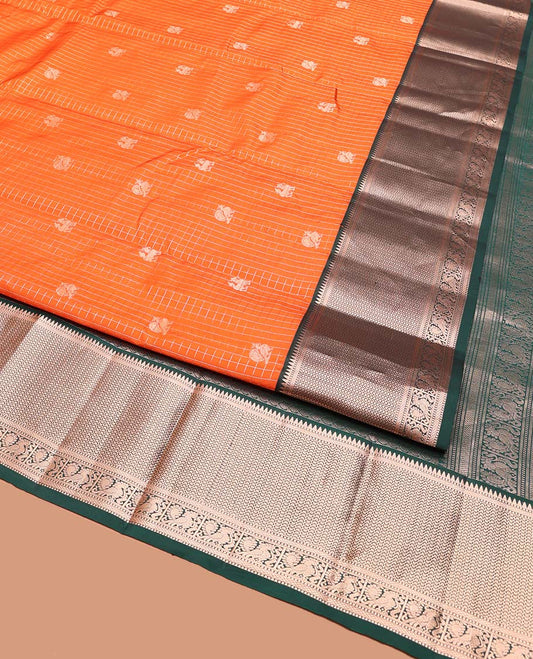 Orange Vasundhara Silk Saree, Embellished with Mayil and Yaali Butta Enclosed Checks on Its Body, Complemented by Contrast Border of Muthu, Rekku, Mayil, and Mayil Kann Designs, Grandly Decked Up Pallu, and Paired with a Contrast Blouse