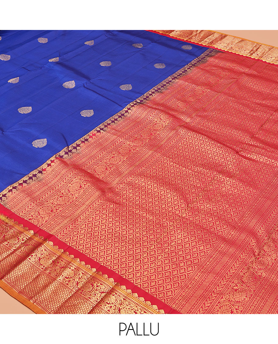Royal Blue Vasundhara Silk Saree, Decorated with Zari Buttas, a Contrast Border of Thilakam Mokku, Muthu, Banaras, Kodi Visiry, and Mayil Kann Designs, Grand Pallu, and a Contrast Blouse