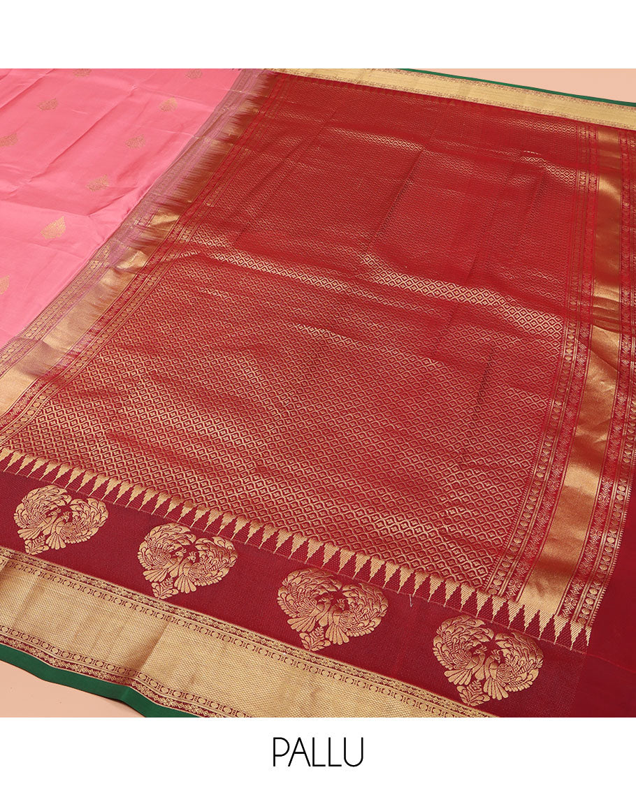 Pink Vasundhara Silk Saree, Finely Designed with Zari Buttas All Over Its Body, Complemented by Contrast Temple Border of Mayil, Rudraksham, and Mayil Kann Designs, Grand Jaal Pallu, and Paired with a Contrast Blouse