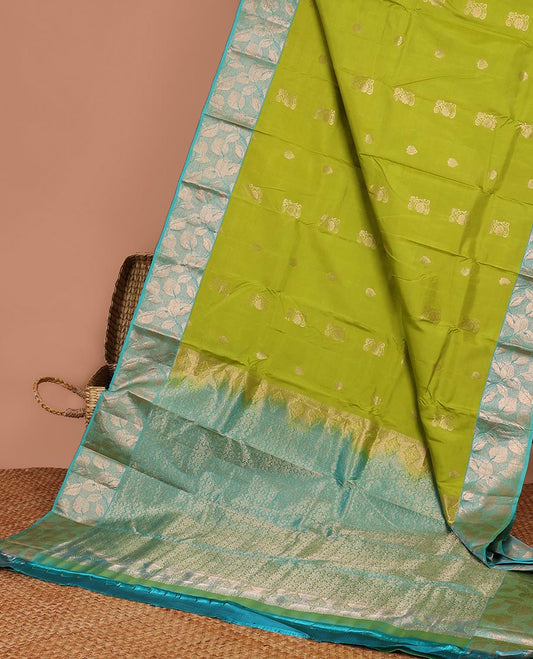 Green floral buttas silk saree with contrast leaf design border &  intricate jaal zari design pallu