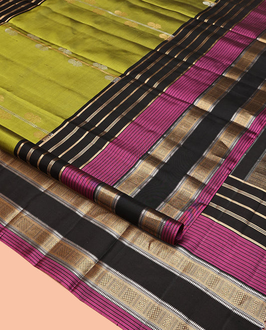 Green Mayuri Soft Silk Saree, Woven with Zari Buttas All Over Its Body, Complemented by a Contrast Border of Traditional Zari Designs, Pallu of Vanki Designs, and Paired with a Contrast Blouse
