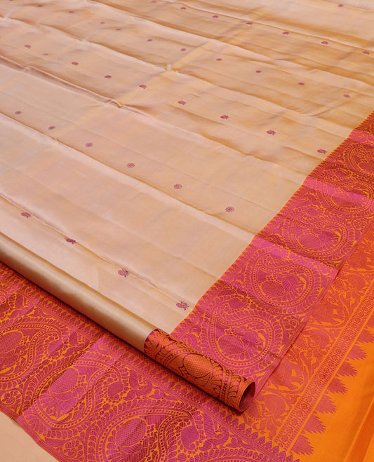 Sandal Kanchipuram Silk Saree, Embellished with Mayil- Chakram Buttas All Over Its Body, Complemented by a Contrast Border of Thilakam Mokku, Kathir, and Mayil Enclosed Arumbu Manga Designs, Subtly Jaal Pallu, and Paired with a Contrast Blouse