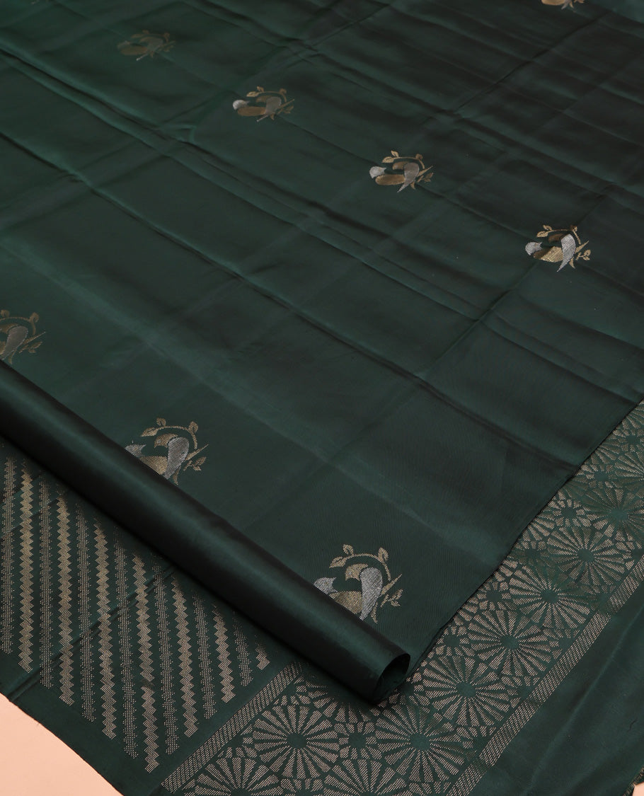 Borderless Green Mayuri Lite Silk Mix Saree, Detailed with Bird Buttas All Over Its Body, Highlighted by a Zari Pallu of Diagonal Stripes and Chakram Designs, and Paired with a Matching Blouse