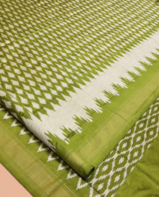 Green Pochampally Ikat Silk Saree, Elevated with Ikkat Buttas on Its Body, Complemented by a Ikkat-Style Woven Temple Border, Pallu of Ogee Patterns, and Paired with a Matching Blouse