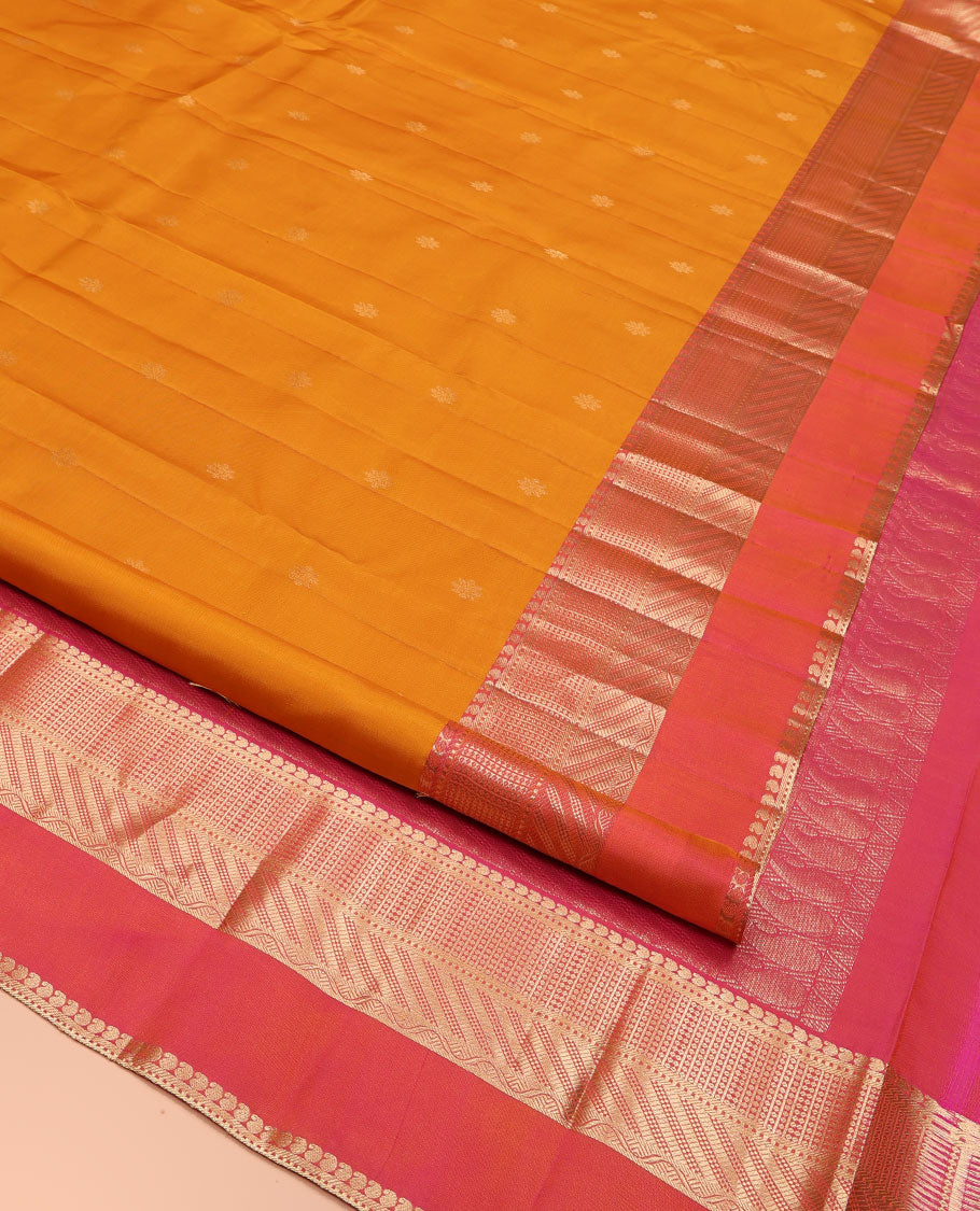 Mango Yellow Kanchipuram Silk Saree, Adorned with Zari Buttas All Over Its Body, Complemented by Contrast Border of Traditional Zari Designs, Grand Diagonal Striped Pallu, and Paired with a Contrast Blouse