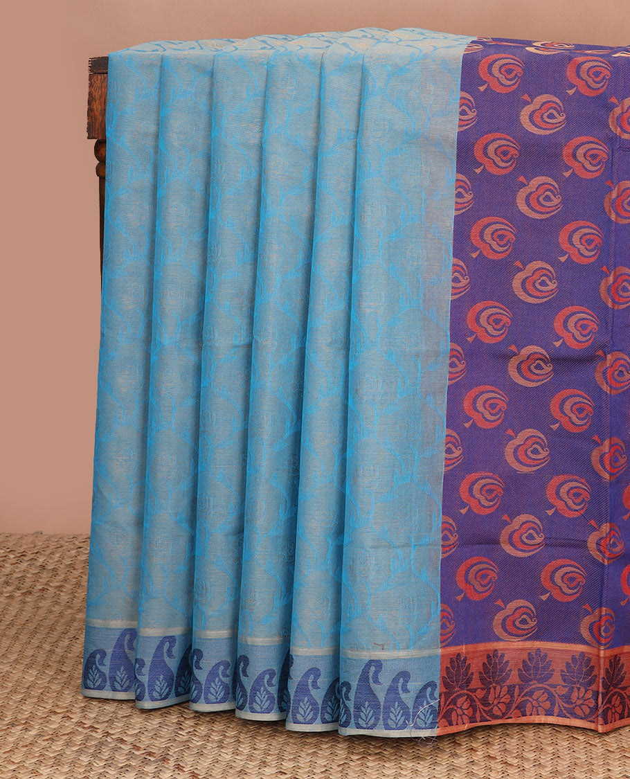 Blue ogee-patterned Coimbatore cotton saree, paisley motif border, & contrast peacock-feather-style motifs pallu