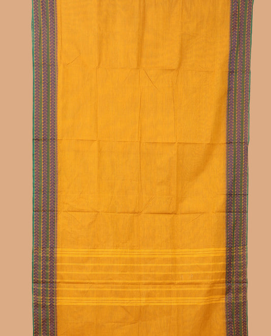 Yellow plain nine-yard cotton saree, temple border of leaf creeper designs, and striped pallu