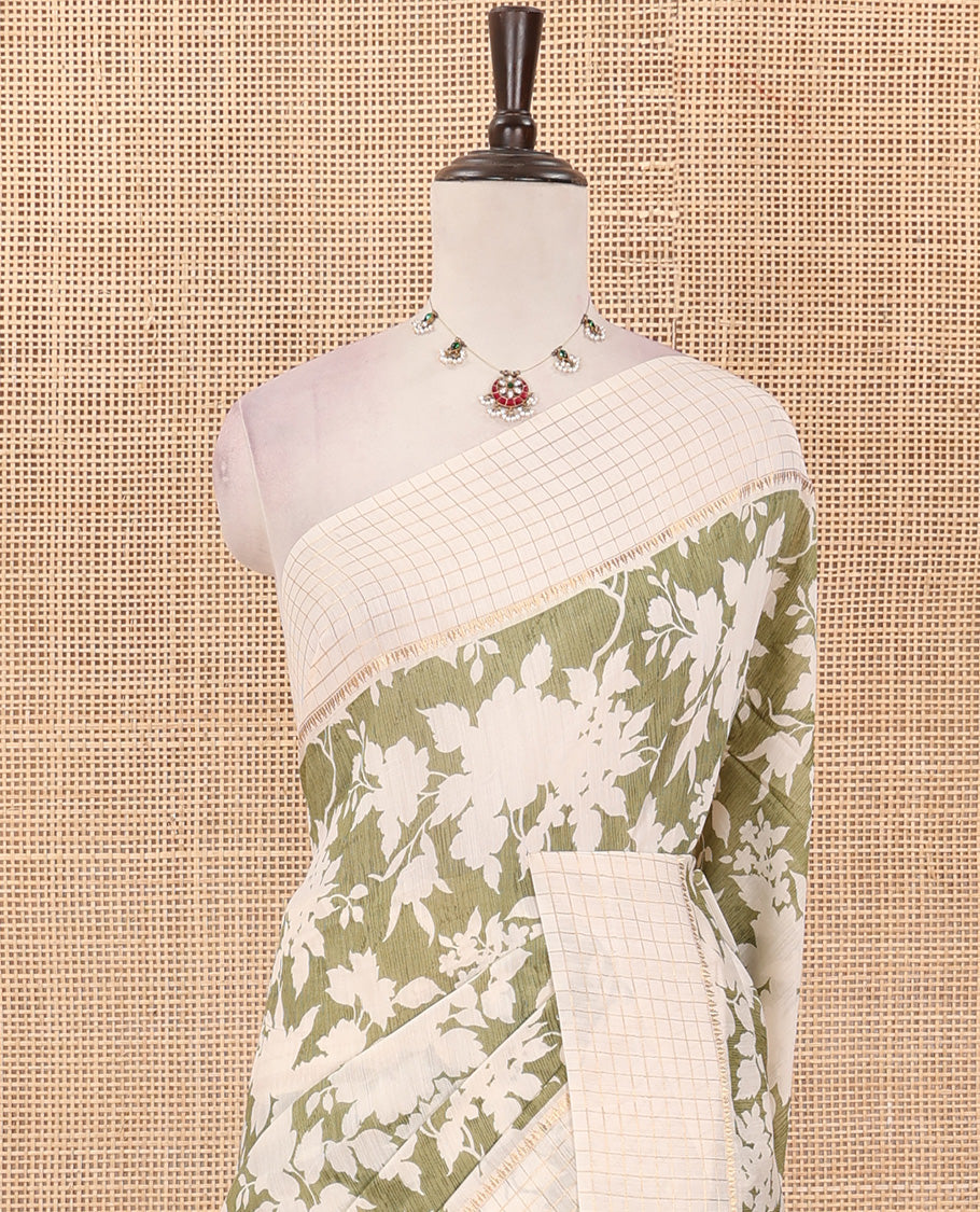 Light olive green silhouettes floral printed Muga silk saree, contrast temple zari checked border, and zari striped pallu