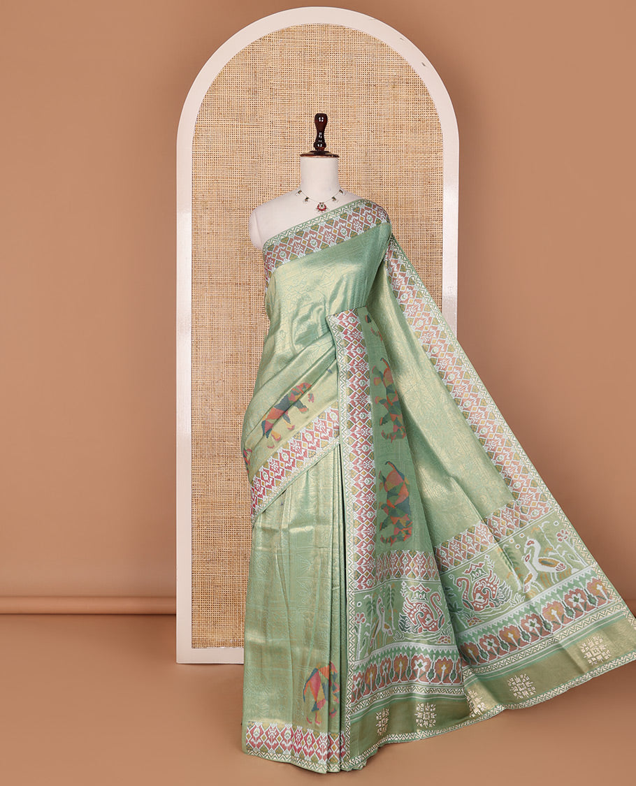 Green butta enclosed buttas designer saree, ikkat diamond patterned stone work border, and ikkat peacock printed pallu