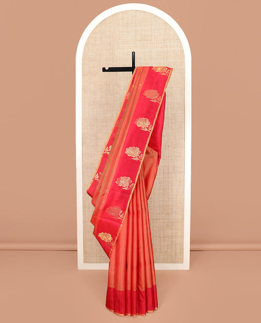 Orange Kanchipuram Silk Saree Featuring All-Over Zari Buttas, Accentuated by a Contrast Border with Flower Zari Buttas, and a Pallu Adorned with Manga Motifs, Paired with a Contrast Plain Blouse