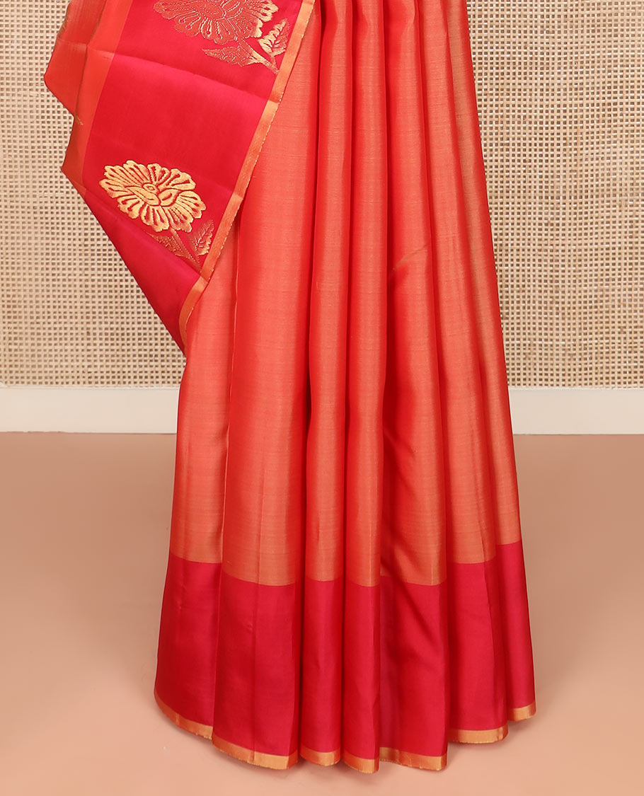 Orange Kanchipuram Silk Saree Featuring All-Over Zari Buttas, Accentuated by a Contrast Border with Flower Zari Buttas, and a Pallu Adorned with Manga Motifs, Paired with a Contrast Plain Blouse