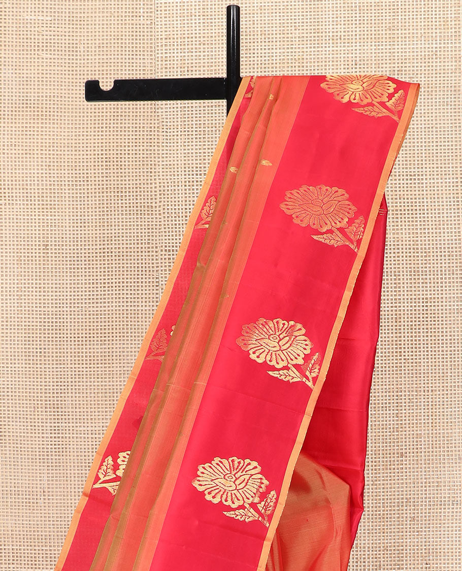 Orange Kanchipuram Silk Saree Featuring All-Over Zari Buttas, Accentuated by a Contrast Border with Flower Zari Buttas, and a Pallu Adorned with Manga Motifs, Paired with a Contrast Plain Blouse
