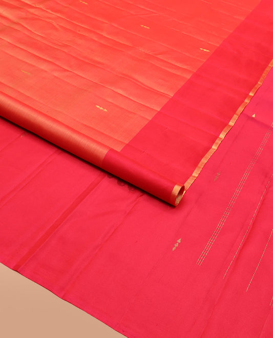 Orange Kanchipuram Silk Saree Featuring All-Over Zari Buttas, Accentuated by a Contrast Border with Flower Zari Buttas, and a Pallu Adorned with Manga Motifs, Paired with a Contrast Plain Blouse