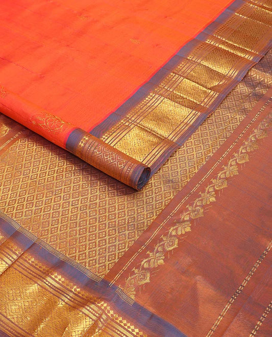Orange buttas kancheepuram silk saree with contrast border of rekku, muthu, banaras, geometric design & argyle design pallu
