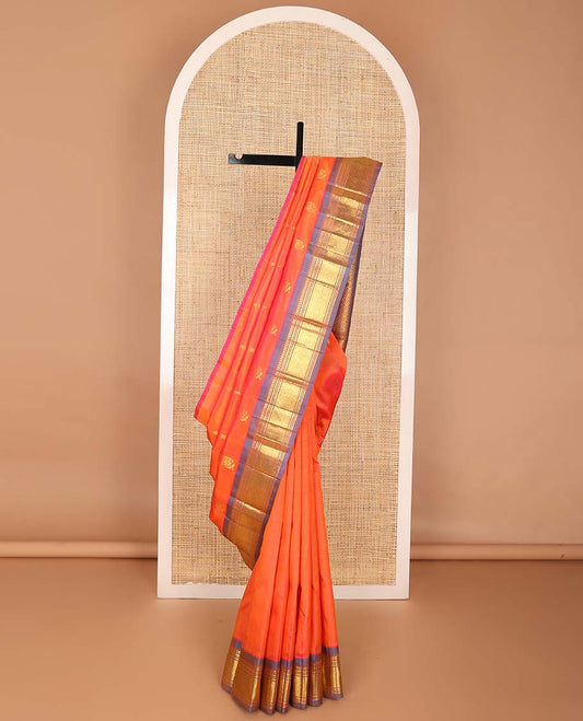 Orange buttas kancheepuram silk saree with contrast border of rekku, muthu, banaras, geometric design & argyle design pallu