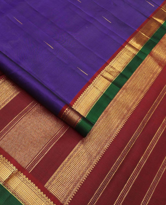 Blue malli mokku buttas Kanchipuram silk saree, contrast border of rekku, neli, and zari designs, and zari woven pallu