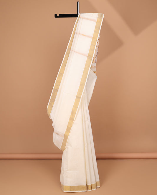 Cream kerala saree with zari designs, zari border & pallu of traditional designs in zari