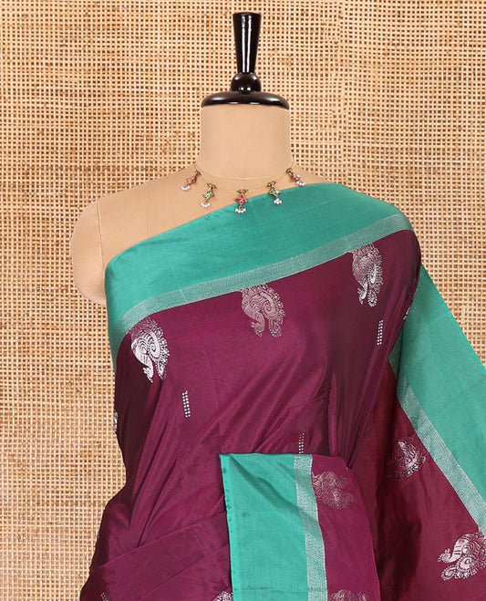 Purple dobby and peacock buttas semi-soft silk saree, contrast zari striped border, zari buttas pallu, and a matching blouse