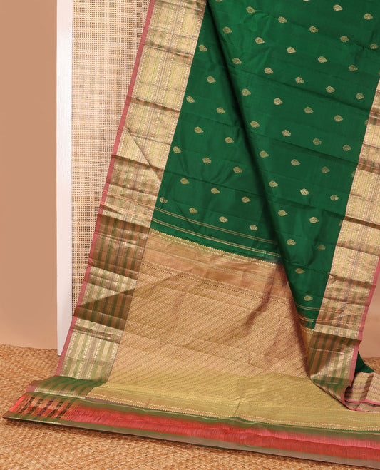 Green buttas silk saree with contrast border of rekku, muthu, paun, banaras design & zari design pallu