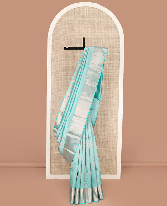 Blue Kanchipuram Wedding Silk Saree Subtly Sparkled with Jacquard Designs, Highlighted with Zari Border of Thilakam Mokku, Banaras, and Mayil Kann Designs, Grandly Zari Woven Pallu, and Paired with a Matching Blouse