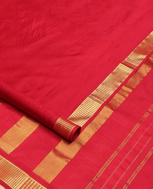 Red plain nine-yard silk saree, zari border, and pallu of muthu stripes