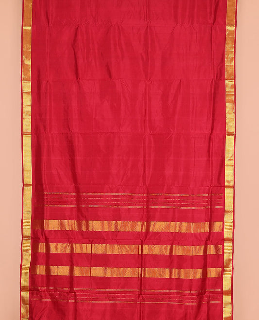 Red plain nine-yard silk saree, zari border, and pallu of muthu stripes