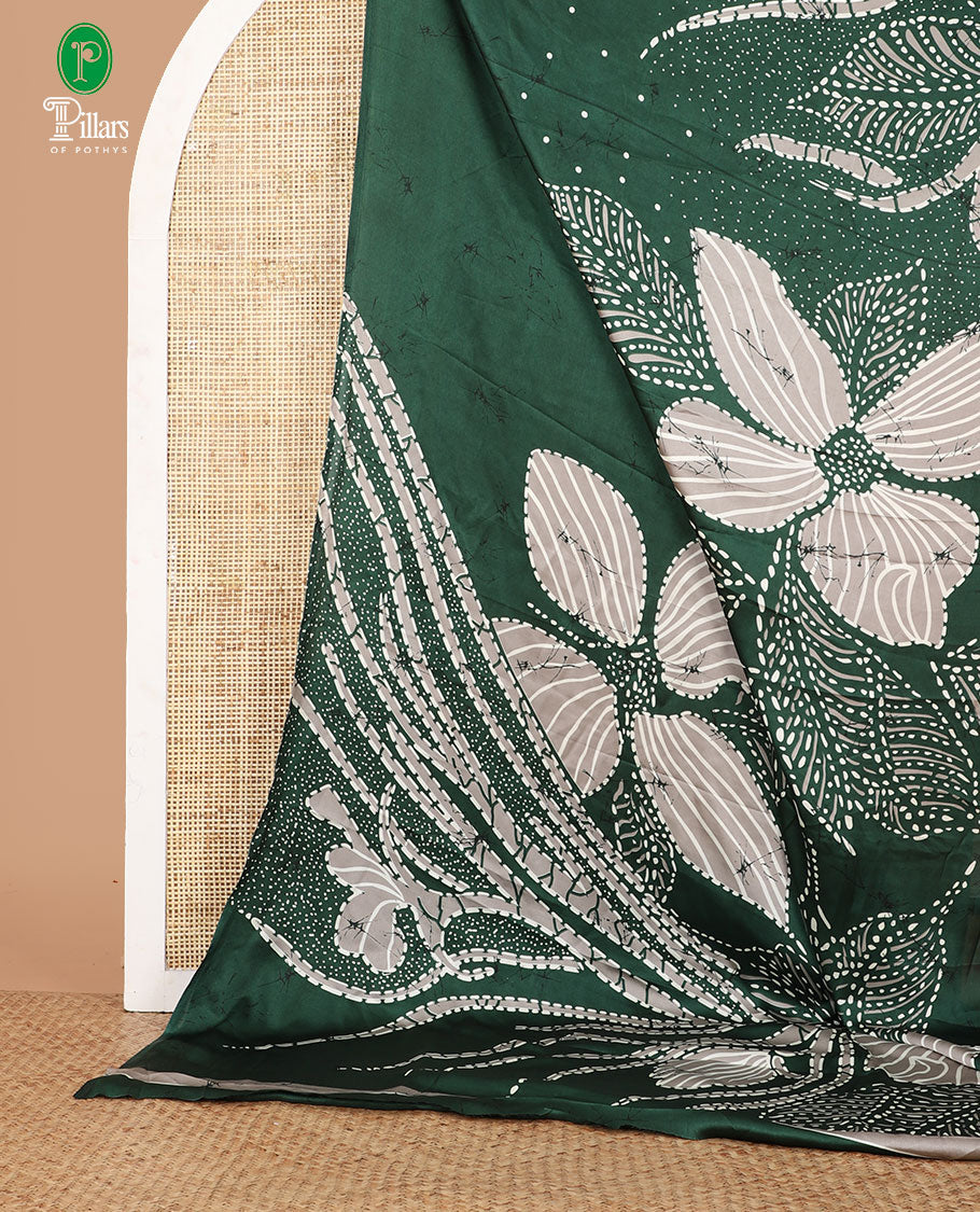 Borderless green half-and-half model satin saree with batik-style big floral motifs digital printed body and pallu
