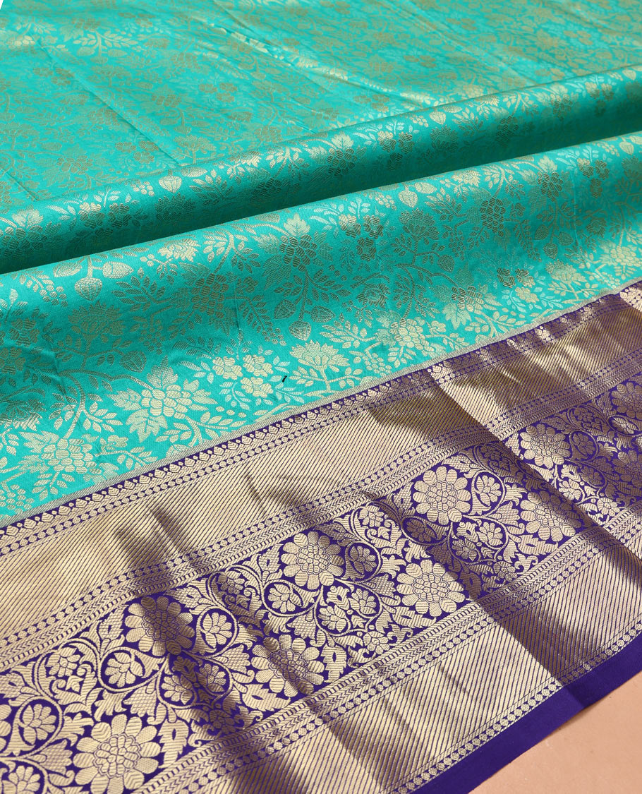 Turquoise Art Silk Material Half Saree, Bedecked with Jacquard Skirt, a Contrast Traditional Zari Border, Contrast Blouse, and an Intricate Dhavani