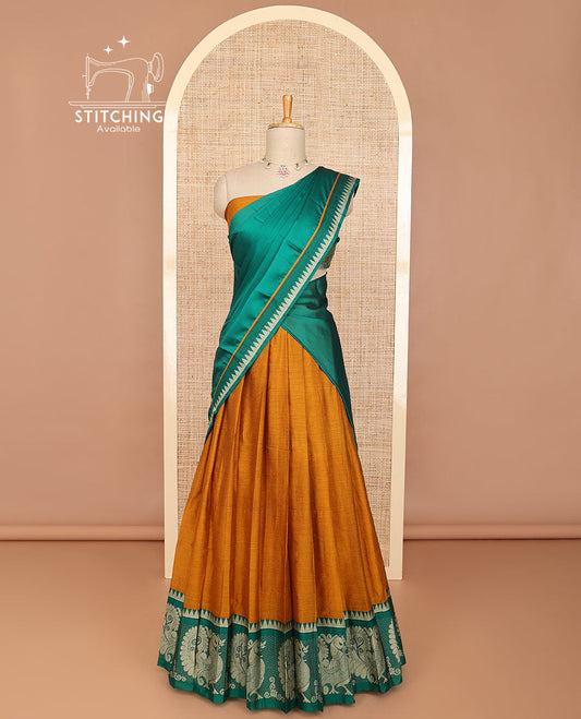 Mustard half saree with contrast peacock design border, embroidered blouse & plain, temple border dhavani