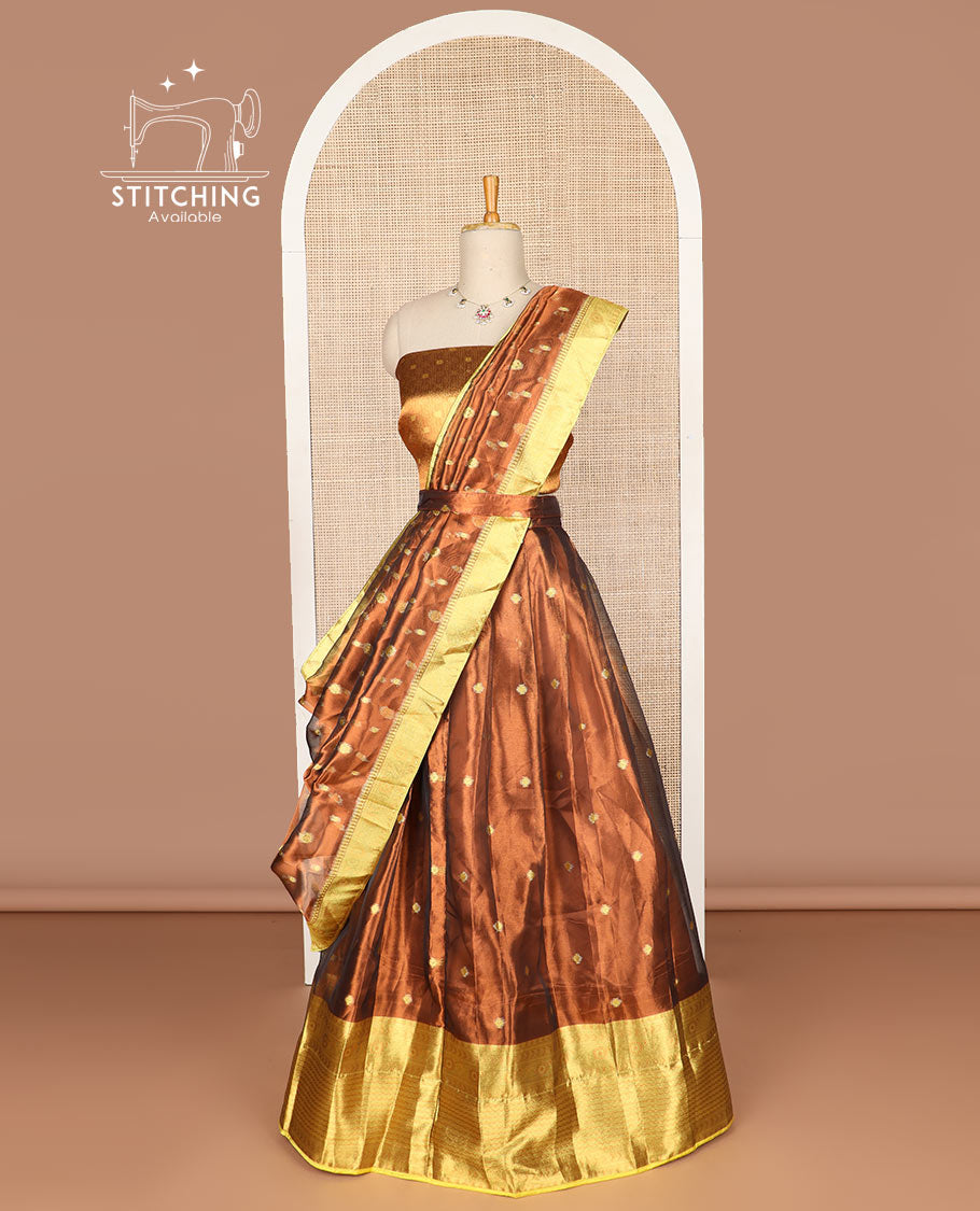 Rust color buttas tissue half saree with contrast zari design border, zari design blouse & floral design dhavani
