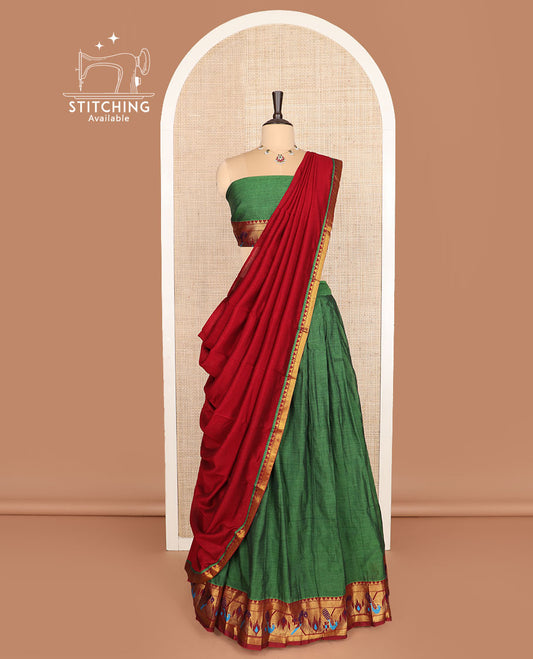 Green cotton half-saree, plain with contrast paithani bordered skirt, matching blouse, and a contrast zari border dhavani