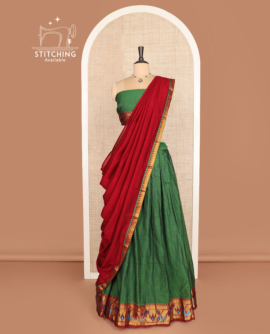 Green cotton half-saree, plain with contrast paithani bordered skirt, matching blouse, and a contrast zari border dhavani