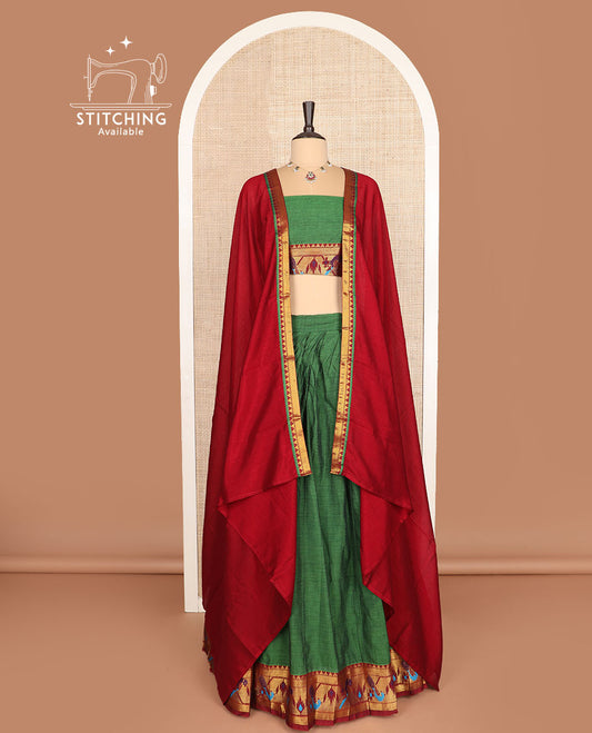 Green cotton half-saree, plain with contrast paithani bordered skirt, matching blouse, and a contrast zari border dhavani