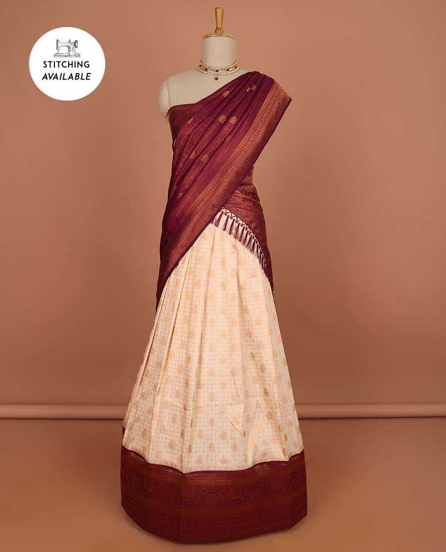 Cream checked , floral design half saree with contrast border, zari design blouse & striped , floral dhavani