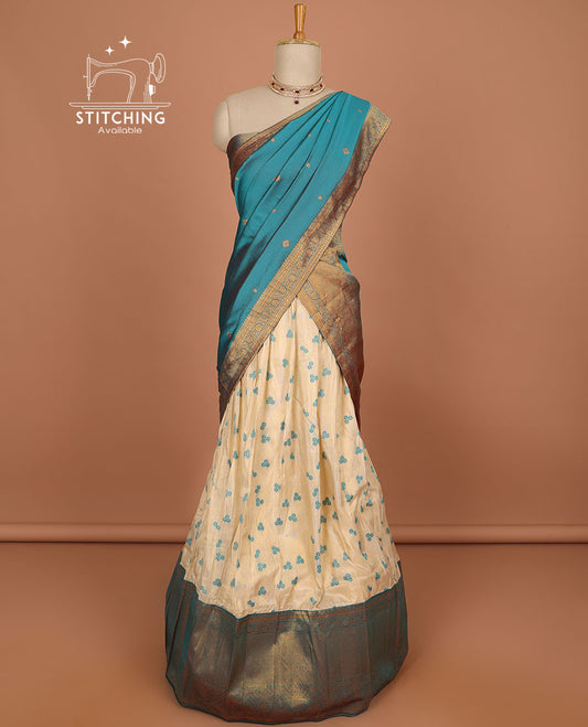 Cream floral buttas half saree with contrast zari border, zari design blouse & blue floral zari design dhavani
