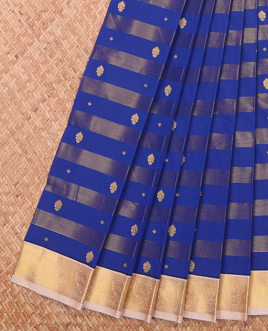 Royal Blue Budget Silk Saree Richly Detailed with Zari Stripes and Zari Buttas, Complemented by a Contrast Peacock Zari Border, Pallu Steeped with Geometric Patterns, and Paired with a Contrast Blouse