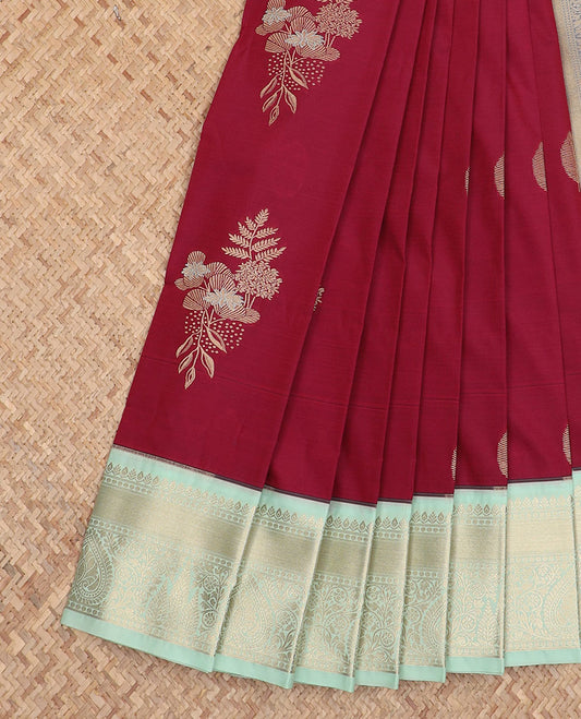 Maroon floral and leaf zari buttas gift saree, contrast traditional zari border, and intricately zari decked up pallu