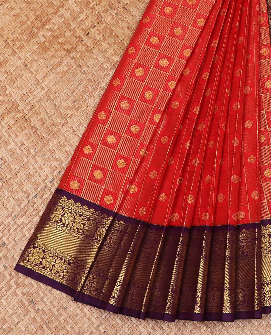 Red butta enclosed checked gift saree, contrast traditional zari design border, and ogee patterned pallu