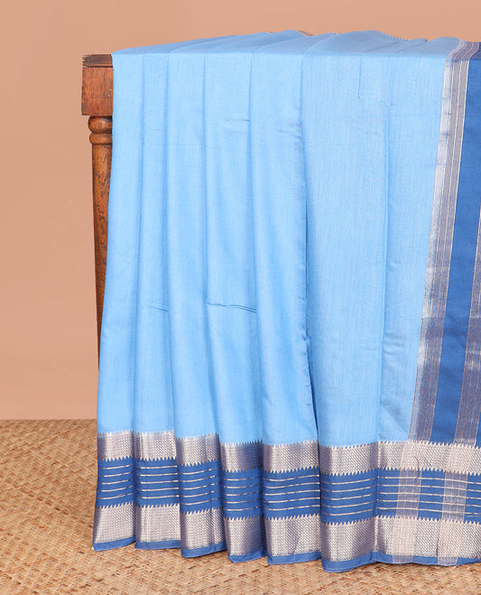 Blue plain assam silk saree, contrast traditional zari border, and pallu of zari stripes