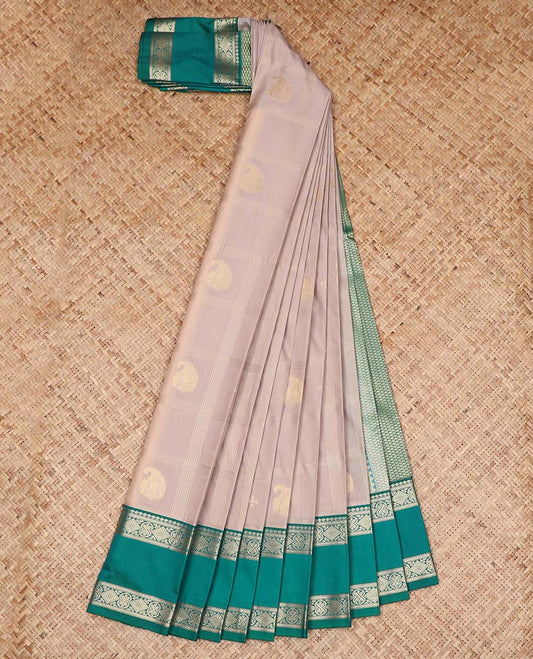 Grey Budget Silk Saree Decked Up with Paisley Buttas Enclosed Checks, Complemented by a Contrast Traditional Zari Design Rettai Pettu Border, Zari Woven Pallu of Jaal Designs, and Paired with a Contrast Blouse