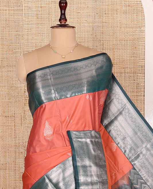 Dark Peach Budget Silk Saree, Gracefully Embellished with Zari Buttas All Over Its Body, Complemented by Contrast Border of Traditional Designs Woven in Zari, Opalescently Detailed Pallu, and Paired with a Contrast Blouse