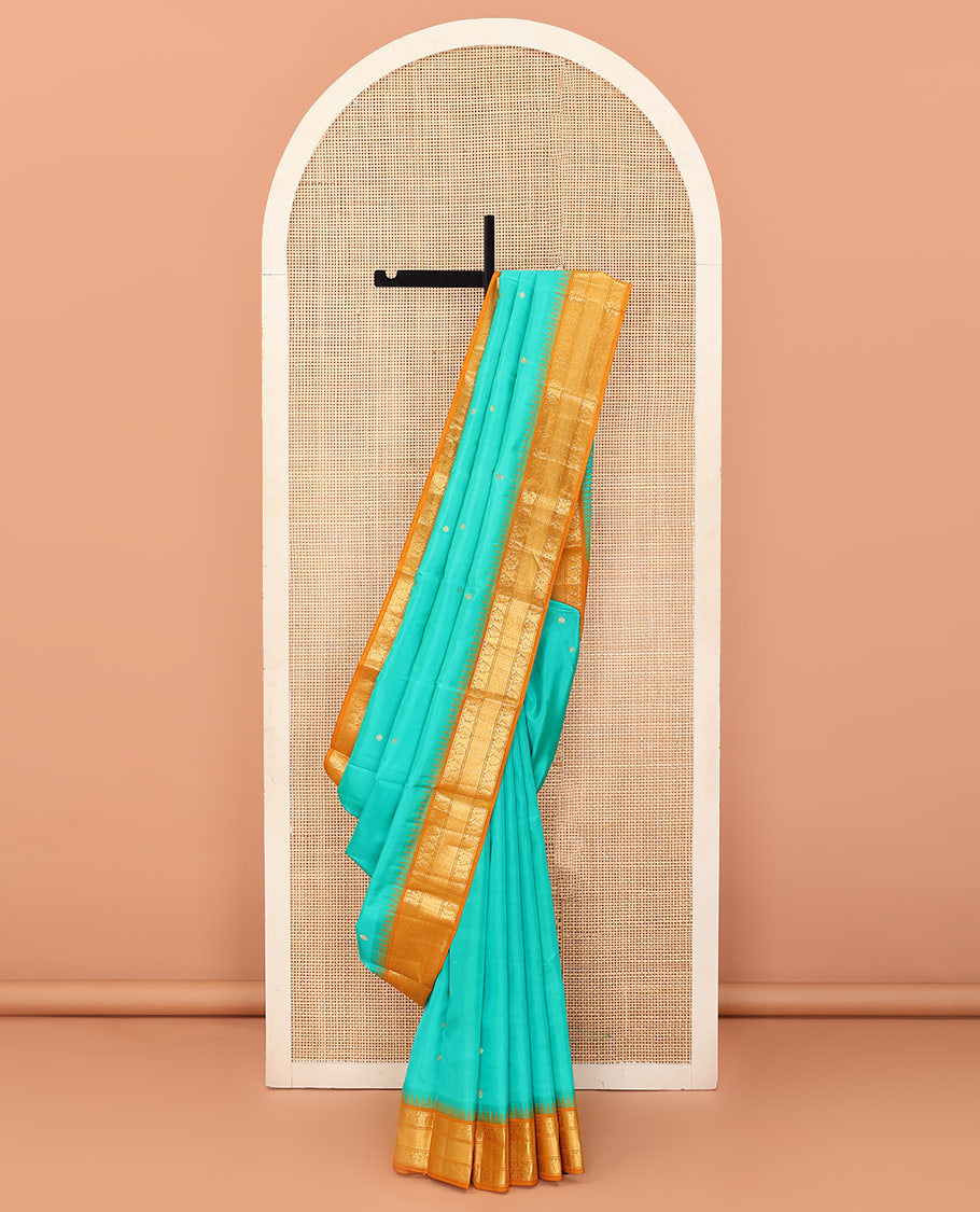 Turquoise buttas Bangalore silk saree, contrast temple traditional zari border, and pallu of jaal designs