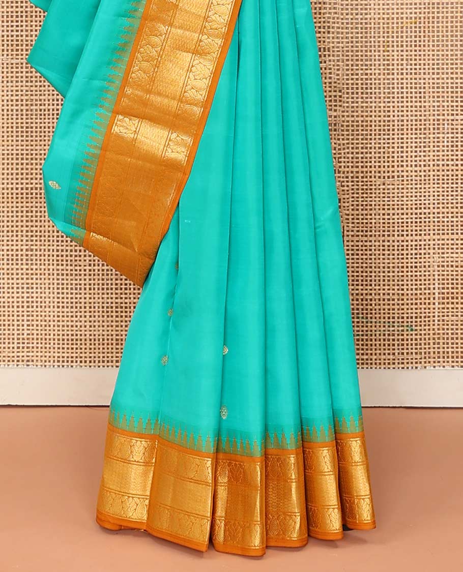 Turquoise buttas Bangalore silk saree, contrast temple traditional zari border, and pallu of jaal designs