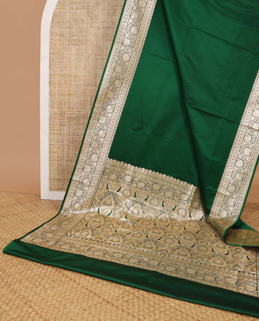 Dark green semi banaras nylon saree with self floral design border & floral ogee design pallu