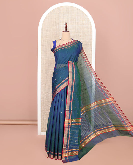Blue Chanderi Cotton Saree, Showcasing Buttas All Over Its Body, Complemented by a Contrast Border, Pallu Steeped with Zari Stripes, and Paired with a Matching Blouse