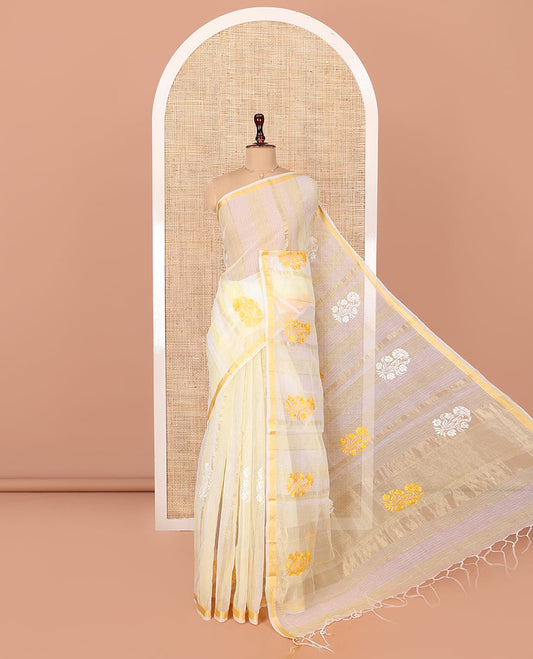 White and Yellow Kota Cotton Saree, Mesmerized with Stripes and Floral Motifs Thread Embroidery on Its Body, Piping Border, Pallu Features Floral Embroidery, and Paired with a Matching Blouse