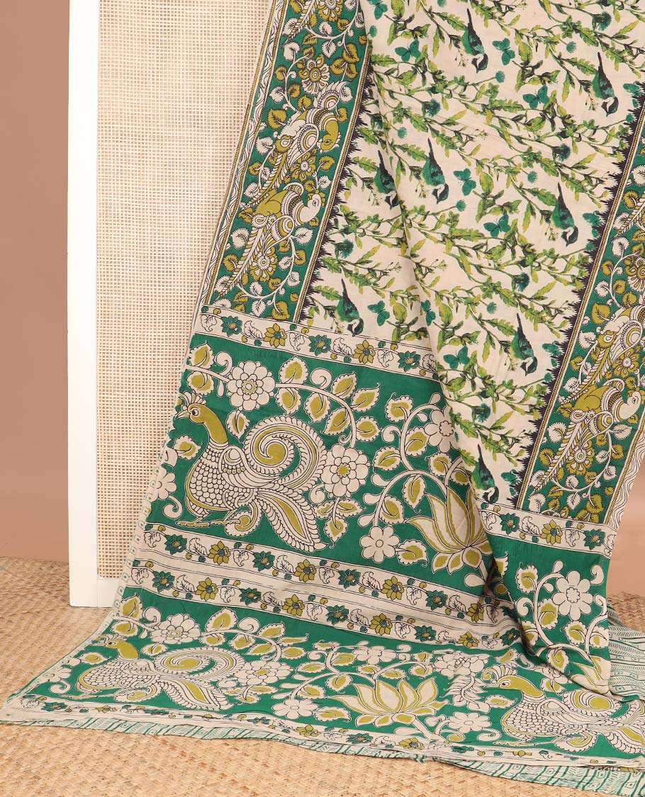 Cream floral, and sparrow machine printed kalamkari cotton saree, contrast floral-peacock border, and pallu of peacocks print